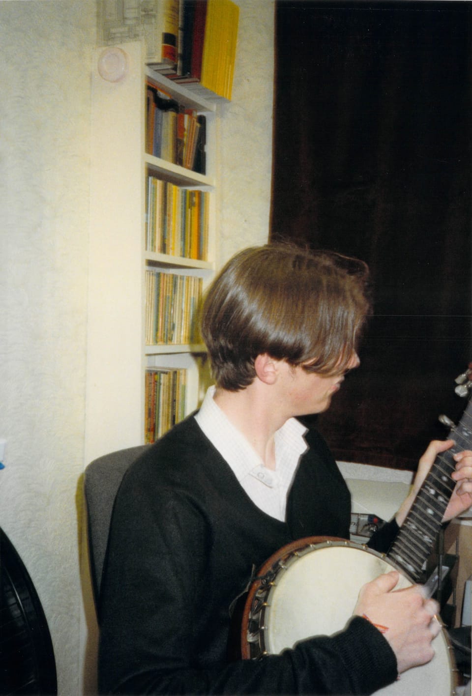 An old photo of Rob Lambert playing the Banjo in circa 1995