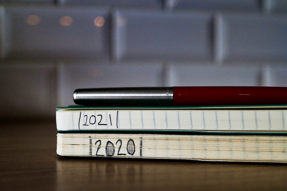 A photo of two moleskine notebooks 