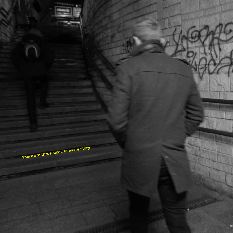 A photo of someone walking up some stairs from a subway with the words 'there are three sides to every story" overlayed