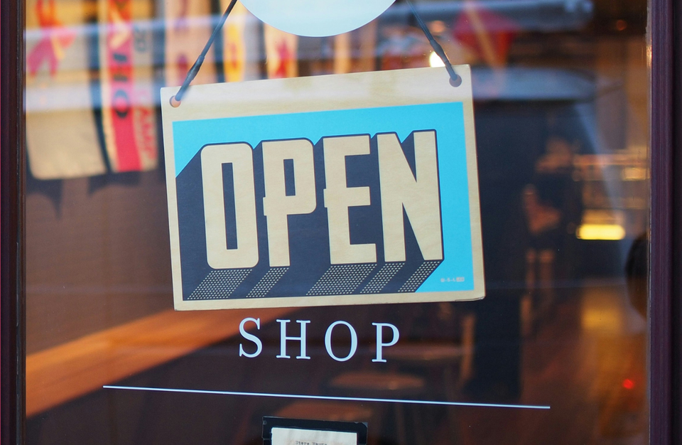 A shop with the word open in the window